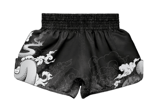 Rear view of custom Muay Thai shorts by ARAYKO. Features a continuous traditional dragon graphic across the back and sides with a reinforced gathered waistband for a secure training fit.