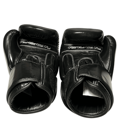 Black boxing gloves in genuine cowhide leather featuring the ‘Hand Made With Pride’ message
