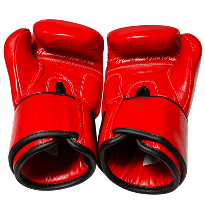 Boxing gloves palm featuring 'Hand Made With Pride' text, symbol of traditional craftsmanship and fighter-focused design