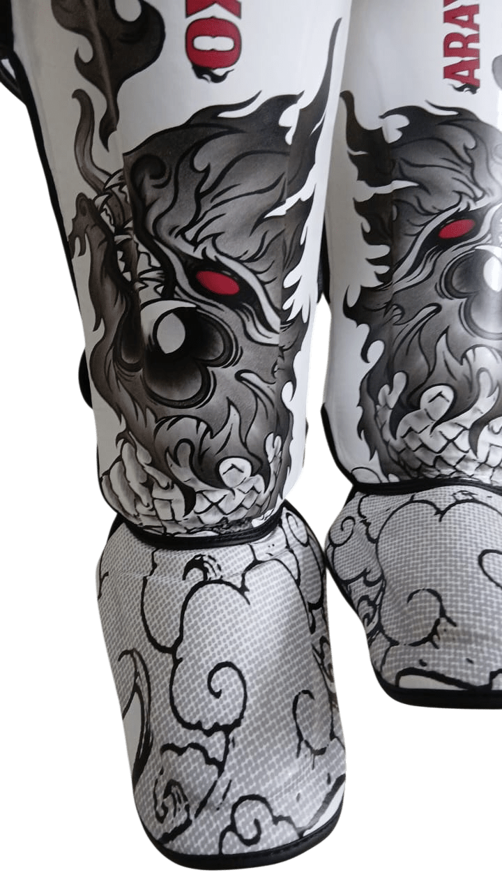 White Muay Thai shin guard featuring a traditional Asian gray dragon design with shading and a striking red eye, printed for professional combat sports