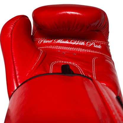 Rear palm view of a Muay Thai glove with 'Hand Made With Pride' script, emphasizing premium leather and craftsmanship