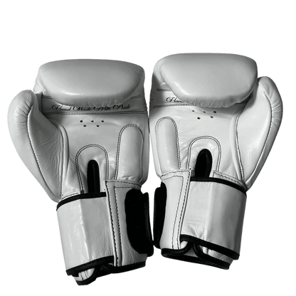 White professional Muay Thai gloves, handcrafted in Thailand with premium stitching and superior padding