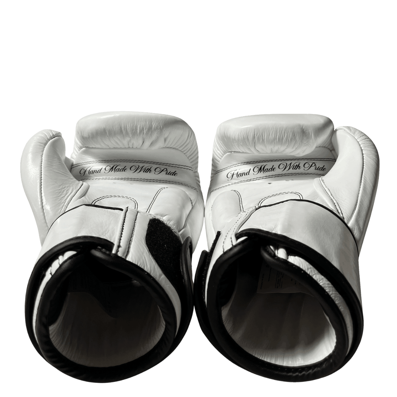 Real leather boxing gloves palm view showing "Hand Made With Pride" text. Professional artisanal boxing equipment